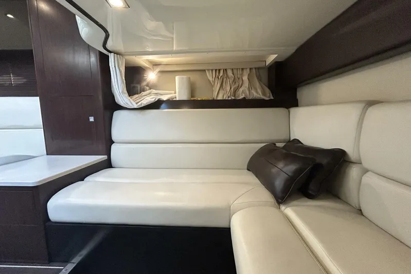  Yacht Photos Pics Luxurious interior of 2015 Monterey 355 Sport Yacht with cream leather seating.