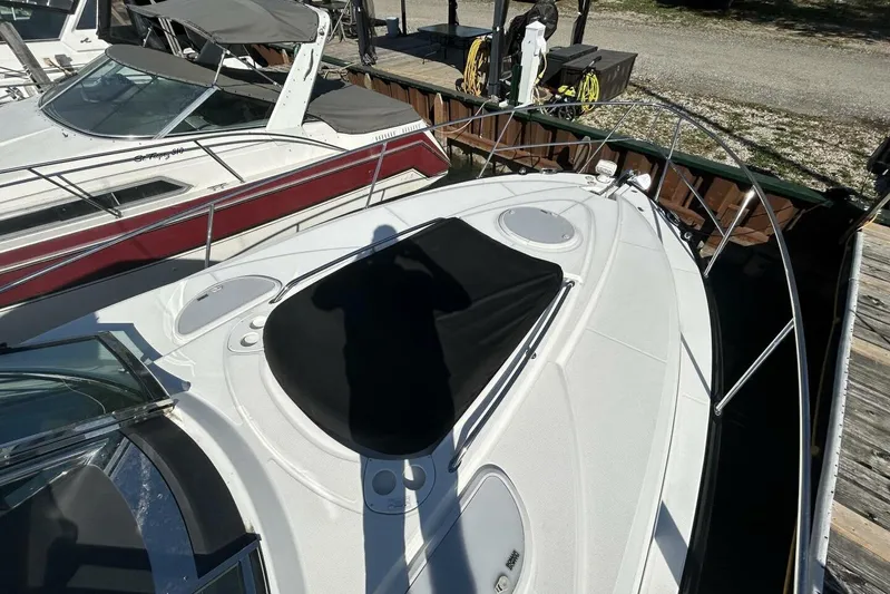  Yacht Photos Pics 2015 Monterey 355 Sport Yacht docked, featuring sleek design and sunshade cover.