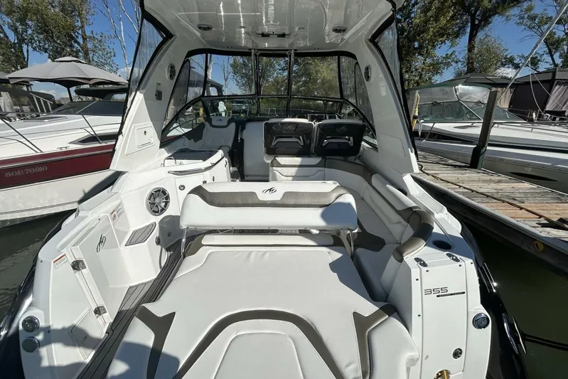  Yacht Photos Pics 2015 Monterey 355 Sport Yacht interior with sleek seating and modern design at a marina.