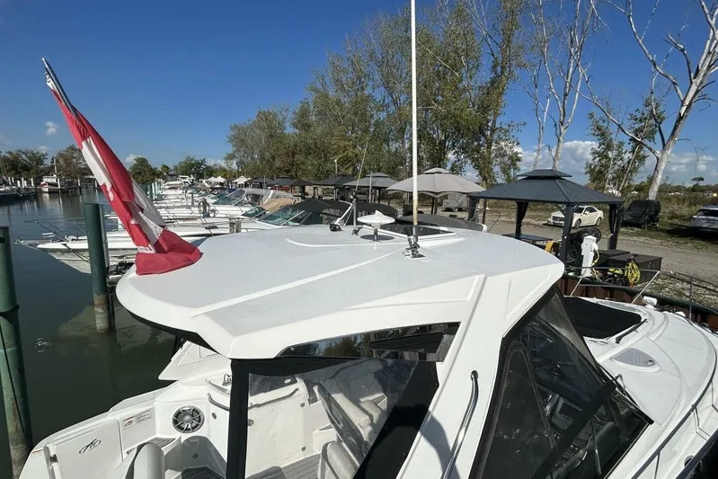  Yacht Photos Pics 2015 Monterey 355 Sport Yacht docked at marina with clear blue sky.