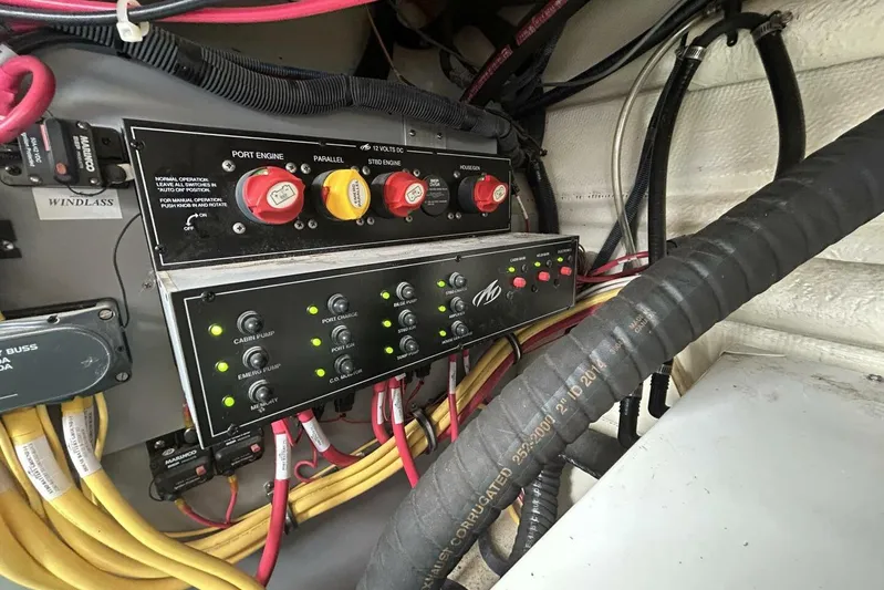 Yacht Photos Pics Electrical panel of a 2015 Monterey 355 Sport Yacht with labeled switches and wiring.