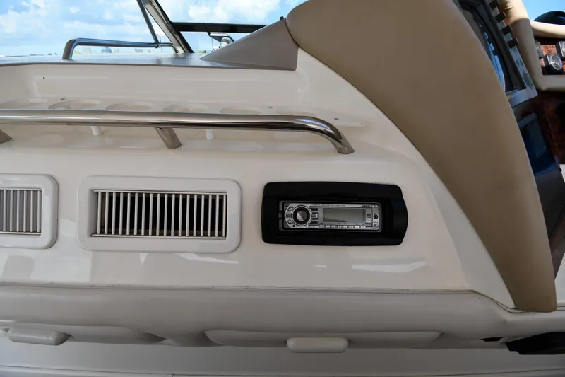  Yacht Photos Pics 1995 Sea Ray 630 Sundancer boat interior with stereo system and ventilation grilles.