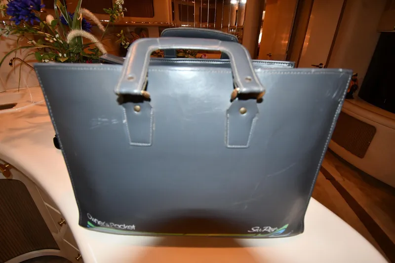  Yacht Photos Pics Gray Sea Ray owner's packet on a 1995 Sea Ray 630 Sundancer yacht interior.