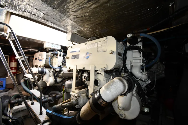  Yacht Photos Pics Engine room of 1995 Sea Ray 630 Sundancer yacht with visible machinery and equipment.