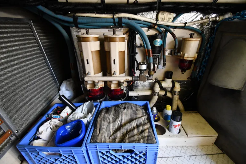  Yacht Photos Pics Engine room of 1995 Sea Ray 630 Sundancer with filters, hoses, and storage crates.
