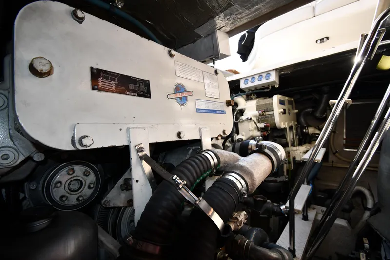  Yacht Photos Pics Engine room of 1995 Sea Ray 630 Sundancer yacht, showcasing mechanical components and equipment.