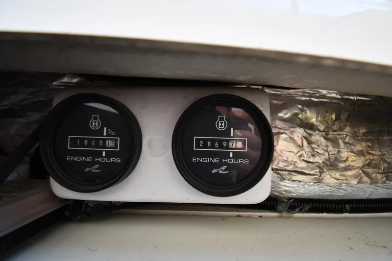  Yacht Photos Pics Engine hour meters on a 1995 Sea Ray 630 Sundancer boat dashboard.