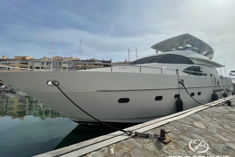  Yacht Photos Pics Luxury 2006 Monte Fino 76 yacht docked at marina under clear sky.