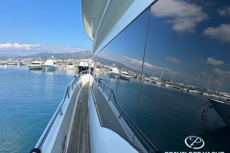  Yacht Photos Pics Monte Fino 76 yacht, 2006 model, docked in a marina with clear blue skies.