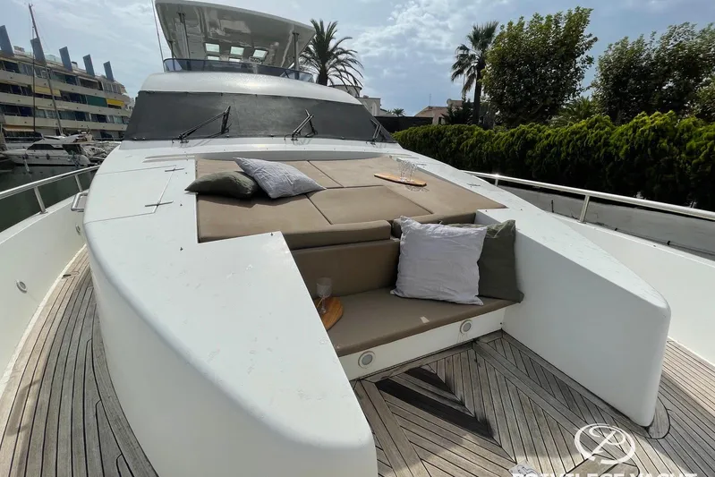  Yacht Photos Pics Luxury Monte Fino 76 yacht deck with cushions, 2006 model, docked in marina.