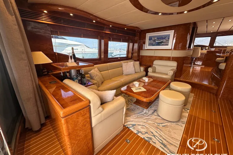  Yacht Photos Pics Luxurious interior of a 2006 Monte Fino 76 yacht with elegant wood finishes.