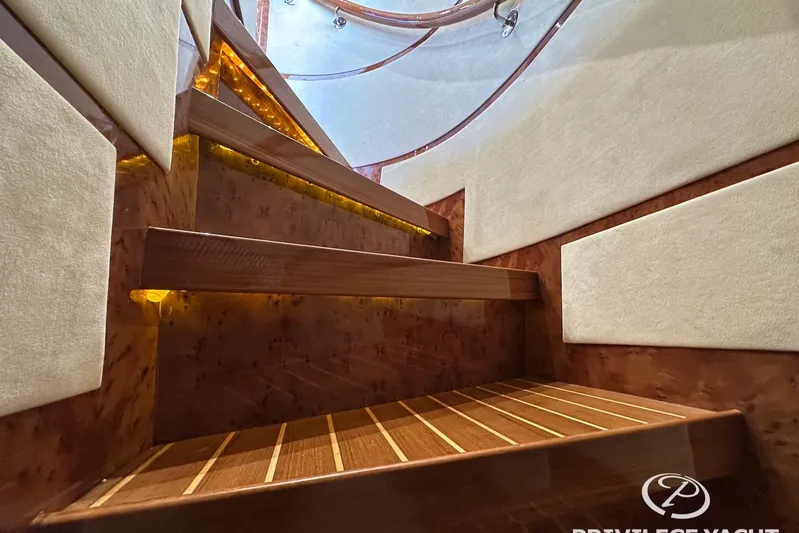  Yacht Photos Pics Luxurious wooden staircase with ambient lighting on a 2006 Monte Fino 76 yacht.