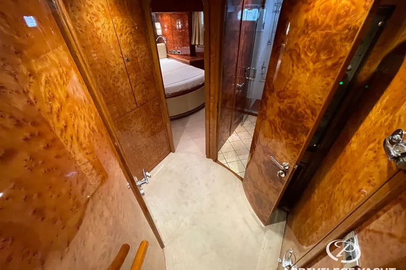  Yacht Photos Pics Luxurious interior of 2006 Monte Fino 76 yacht with polished wood finish.
