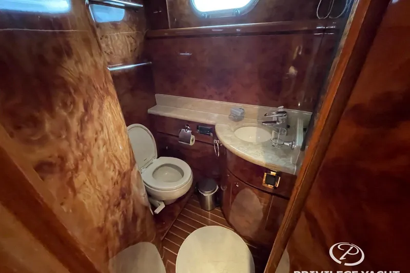  Yacht Photos Pics Luxurious bathroom interior of 2006 Monte Fino 76 yacht with wood finish.