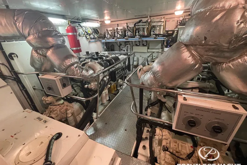  Yacht Photos Pics Engine room of a 2006 Monte Fino 76 yacht, featuring machinery and insulation.