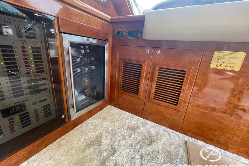  Yacht Photos Pics Luxurious interior of 2006 Monte Fino 76 yacht with control panel and wine cooler.