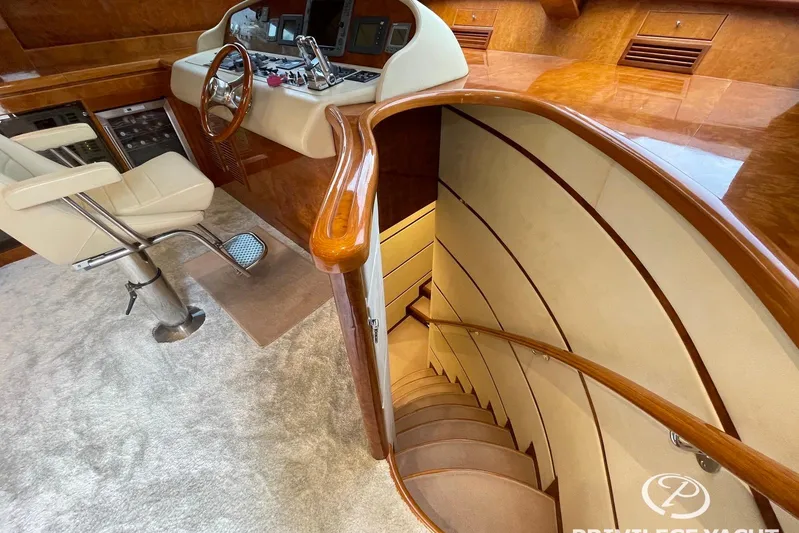  Yacht Photos Pics Luxurious interior of 2006 Monte Fino 76 yacht with elegant staircase and helm station.