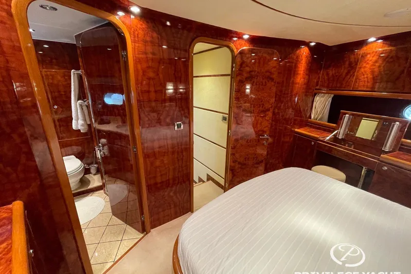  Yacht Photos Pics Luxurious 2006 Monte Fino 76 yacht interior with elegant wood finish and ensuite bathroom.