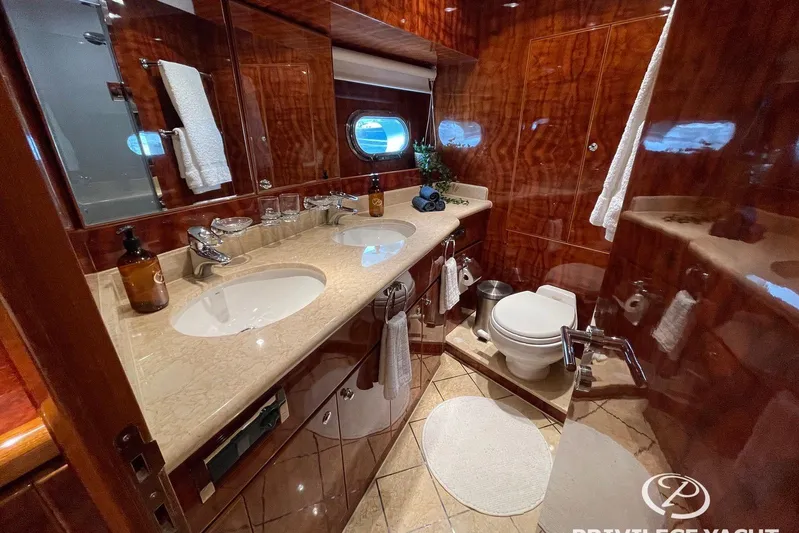  Yacht Photos Pics Luxurious bathroom on 2006 Monte Fino 76 yacht with elegant wood finishes and modern amenities.