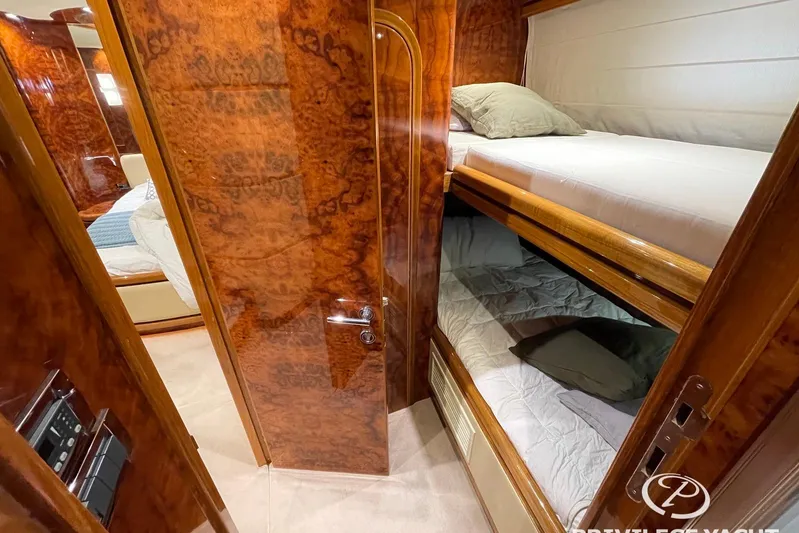  Yacht Photos Pics Luxurious 2006 Monte Fino 76 yacht interior with elegant wood finish and cozy bunk beds.