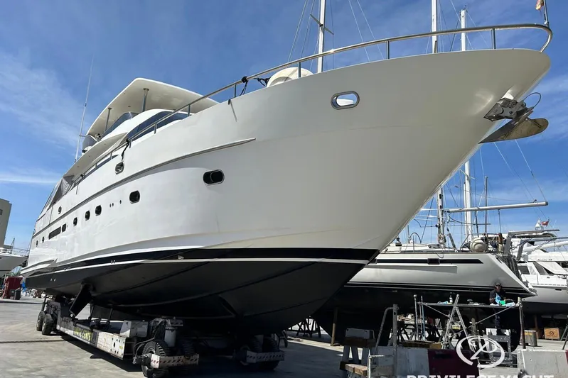  Yacht Photos Pics 2006 Monte Fino 76 yacht on dry dock, showcasing sleek design and luxury features.