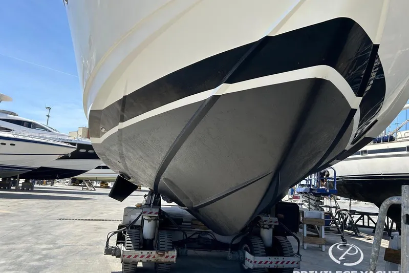  Yacht Photos Pics Monte Fino 76 yacht from 2006 on a trailer in a shipyard.