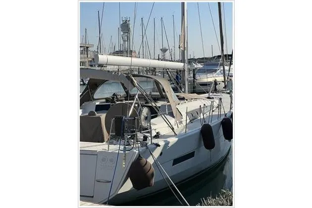  Yacht Photos Pics 2017 Dufour Exclusive 56 yacht docked in marina, featuring sleek design and modern amenities.