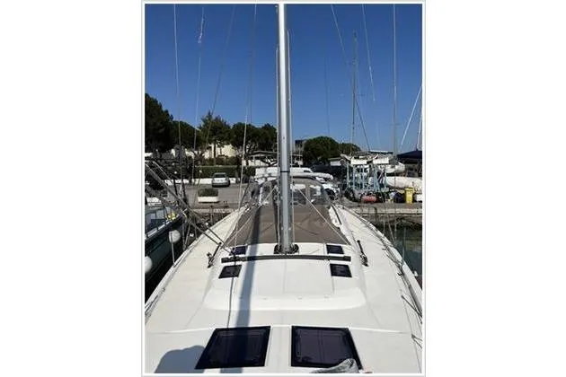  Yacht Photos Pics Dufour Exclusive 56 yacht, 2017 model, docked at marina with clear blue sky.