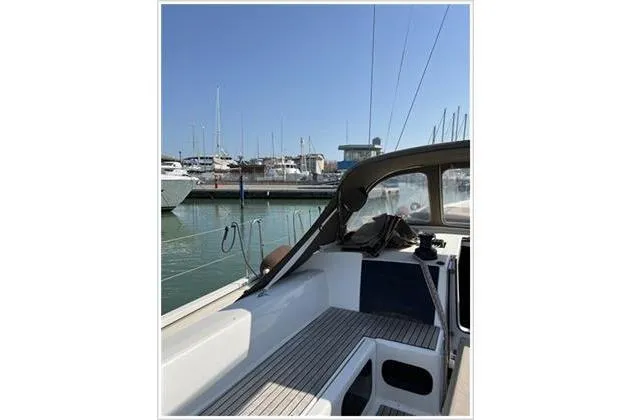  Yacht Photos Pics 2017 Dufour Exclusive 56 yacht docked in a marina, showcasing sleek deck design.