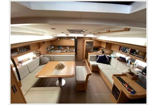  Yacht Photos Pics Luxurious interior of 2017 Dufour Exclusive 56 yacht with elegant seating and dining area.