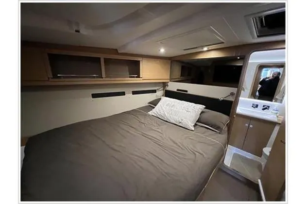  Yacht Photos Pics Luxurious cabin interior of 2017 Dufour Exclusive 56 yacht with cozy bedding.