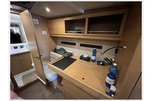  Yacht Photos Pics Interior of 2017 Dufour Exclusive 56 yacht with wooden cabinetry and modern amenities.