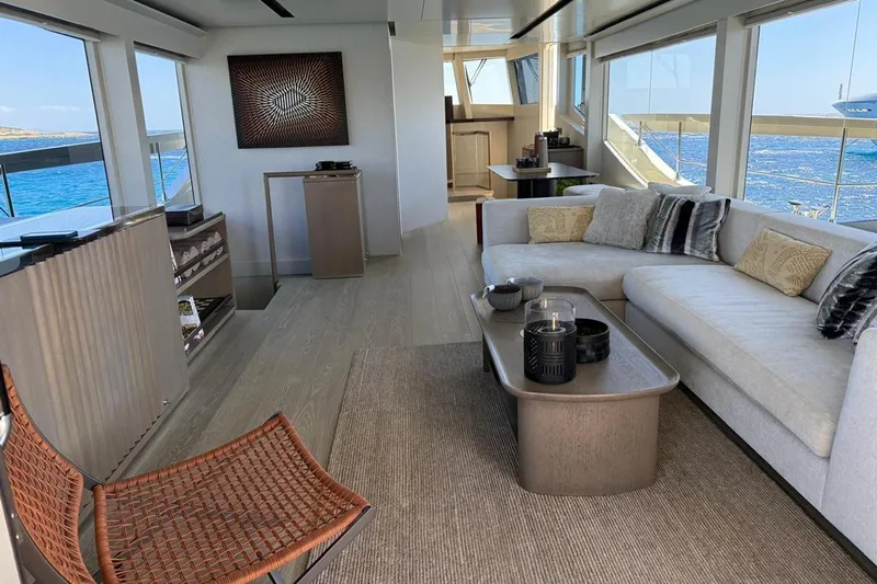  Yacht Photos Pics Luxurious interior of 2022 Numarine 22XP yacht with modern furnishings and ocean view.