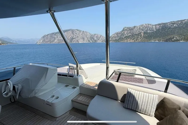  Yacht Photos Pics Luxurious 2022 Numarine 22XP yacht interior with scenic ocean and mountain views.