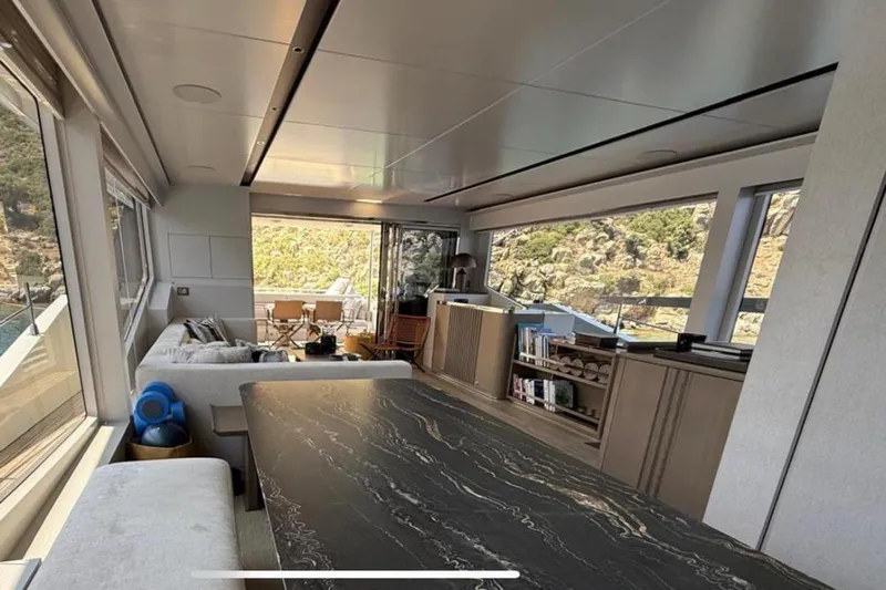  Yacht Photos Pics Luxurious interior of 2022 Numarine 22XP yacht with modern furnishings and scenic views.