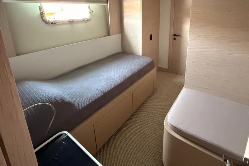  Yacht Photos Pics Interior cabin of 2022 Numarine 22XP yacht with bed and window.