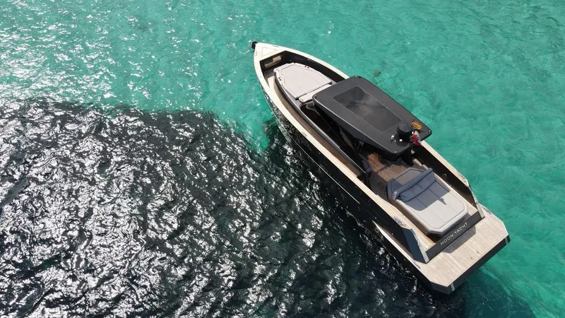 New 2025 Moon 45 Sports Line Yacht Photos Pics Aerial view of 2025 Moon 45 Sportsline yacht on turquoise water.