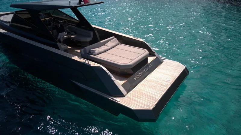 New 2025 Moon 45 Sports Line Yacht Photos Pics 2025 Moon 45 Sportsline yacht on clear turquoise water, featuring sleek design and spacious deck.