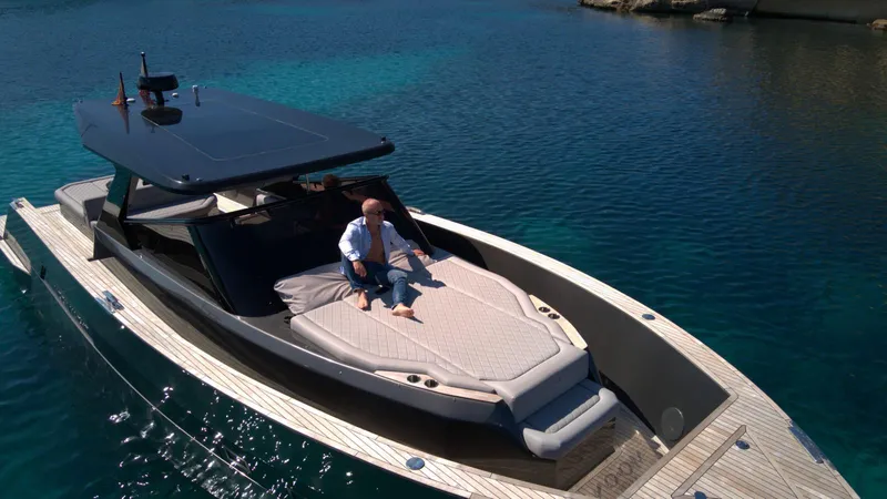 New 2025 Moon 45 Sports Line Yacht Photos Pics Luxury 2025 Moon 45 Sportsline yacht on clear blue water, featuring sleek design and sunbathing area.