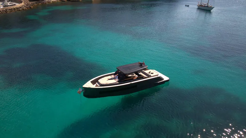 New 2025 Moon 45 Sports Line Yacht Photos Pics Luxury yacht Moon 45 Sportsline 2025 on clear turquoise water.