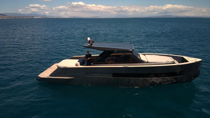 New 2025 Moon 45 Sports Line Yacht Photos Pics 2025 Moon 45 Sportsline yacht cruising on open sea under clear skies.