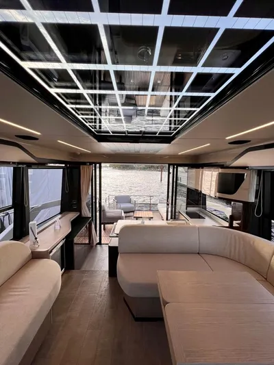  Yacht Photos Pics Luxurious interior of 2025 Absolute 48 Coupe yacht with modern design and panoramic views.