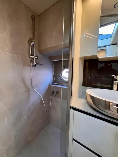  Yacht Photos Pics Luxurious bathroom in 2025 Absolute 48 Coupe yacht with modern fixtures and elegant design.