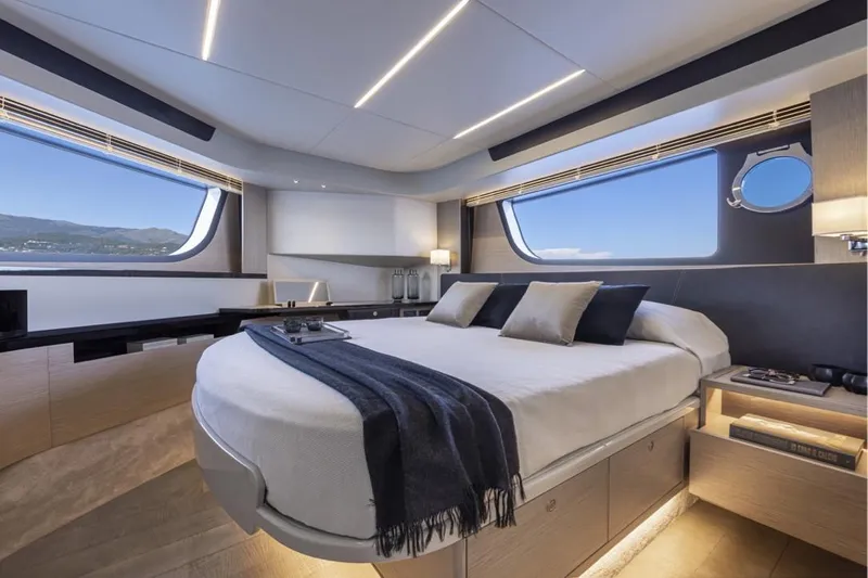  Yacht Photos Pics Luxurious interior of 2025 Absolute 48 Coupe yacht with modern bedroom design.