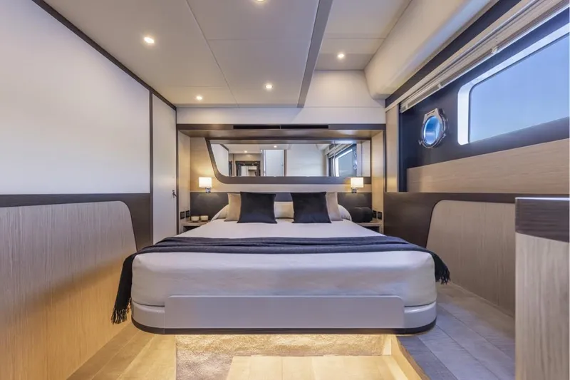  Yacht Photos Pics Luxurious interior of 2025 Absolute 48 Coupe yacht bedroom with modern design.