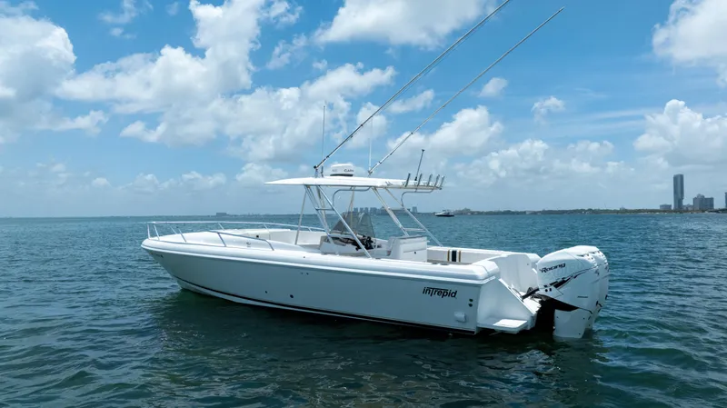  Yacht Photos Pics 1999 Intrepid 35 boat on open water under a clear blue sky.