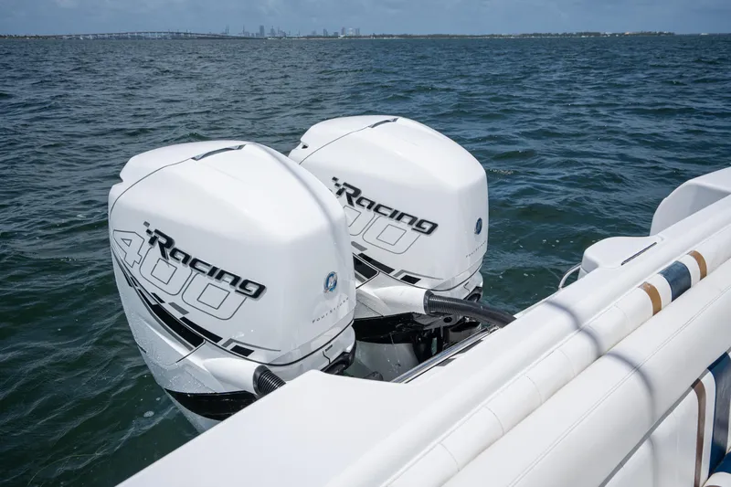  Yacht Photos Pics Twin Racing 400 outboard motors on a 1999 Intrepid 35 boat, cruising on open water.