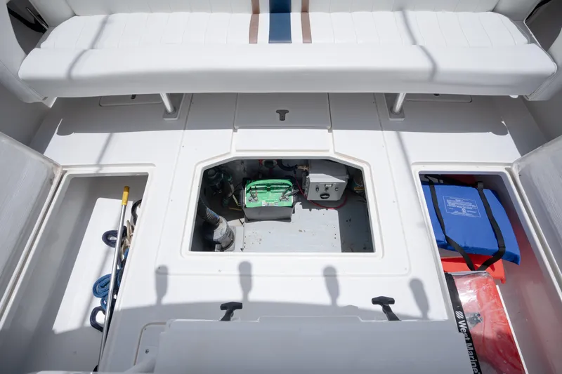  Yacht Photos Pics 1999 Intrepid 35 boat interior with storage compartments and equipment.