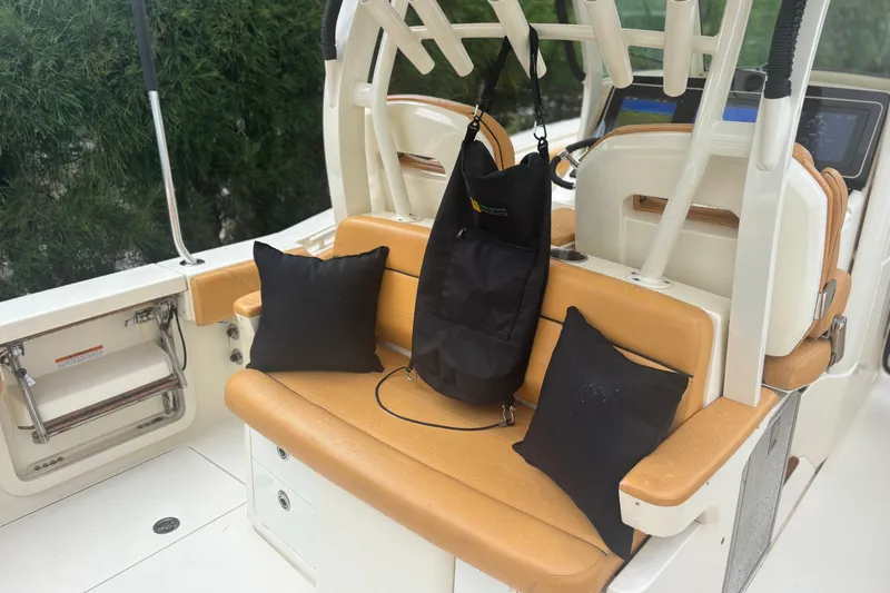  Yacht Photos Pics 2014 Scout 350 LXF boat interior with tan seating and black accessories.