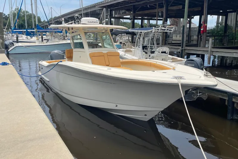  Yacht Photos Pics 2015 Scout 300 LXF boat docked at marina with Yamaha engines.